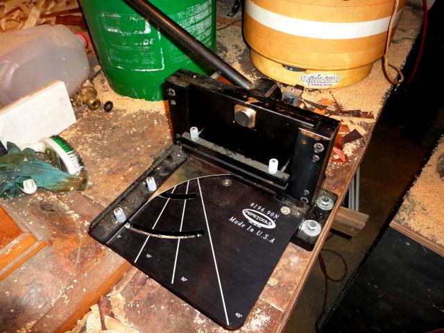 The metal shear to trim off a thin strip.