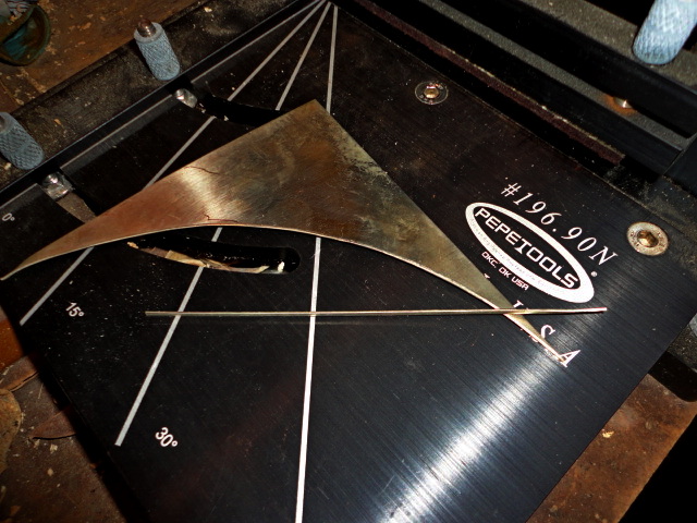 The scrap and thin strip after it was sheared off.