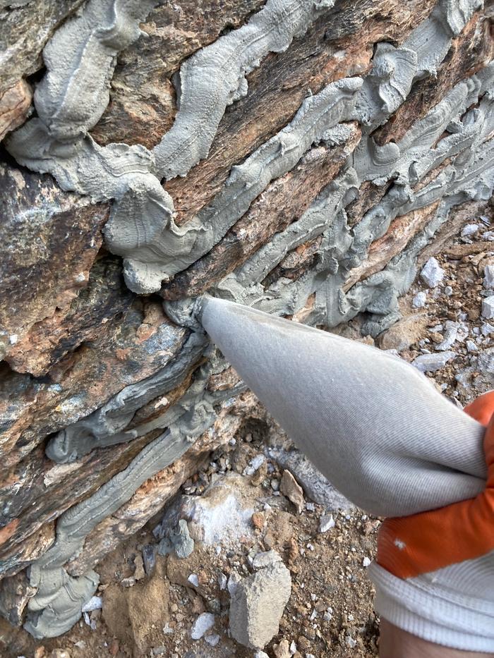 Pointing the joints with a grout bag