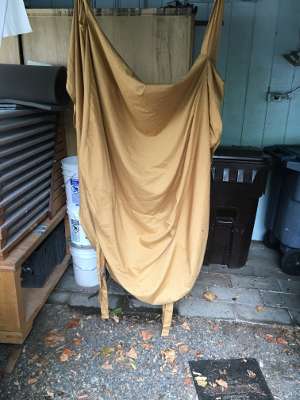 love seat cover awkwardly hanging to dry