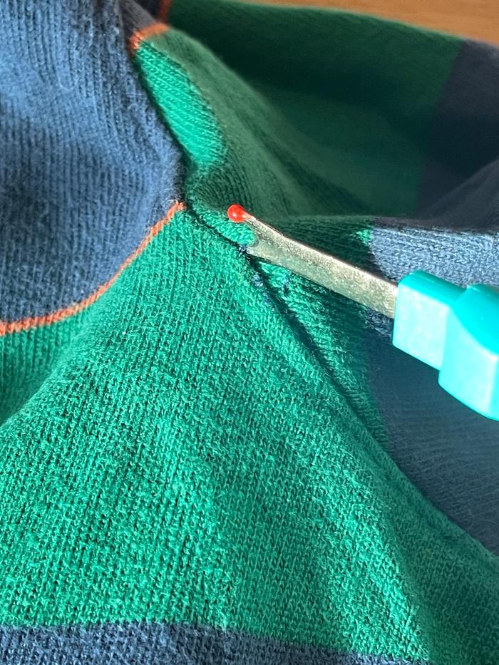 opening a seam with a seam ripper