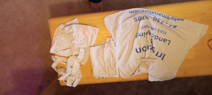 cuttinf up an old t-shirt for fabric scraps