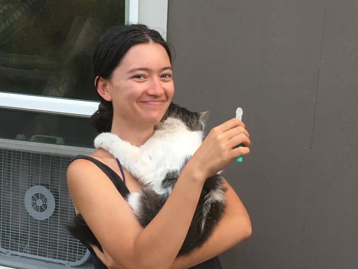 Brushing teeth cat hugs