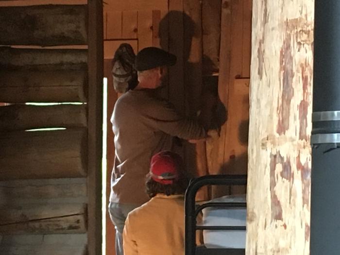 Installing insulation at Cooper cabin, G abs and C