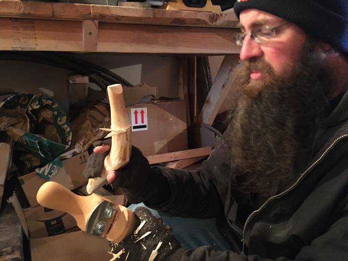 J carving a dowel end for a towel rack