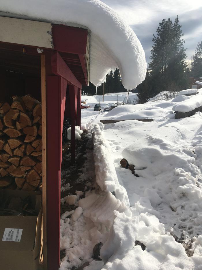 The way the snow slowly slides off the metal roof..