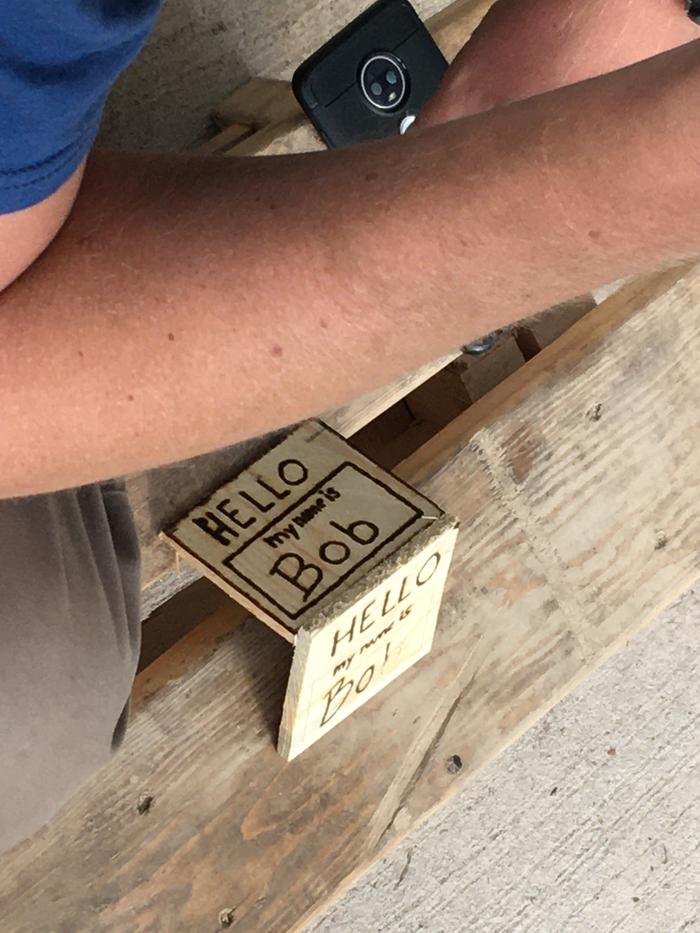 Using a magnifying glass to burn wood