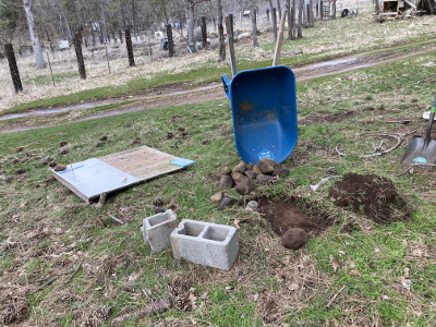 light excavation to create a level area for permanent marker and local rocks delivered (by me)