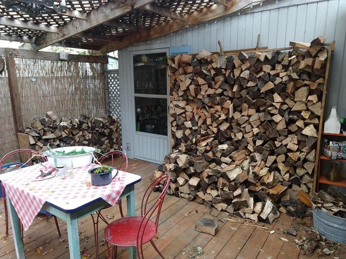 Firewood in messy stack, before rack was built