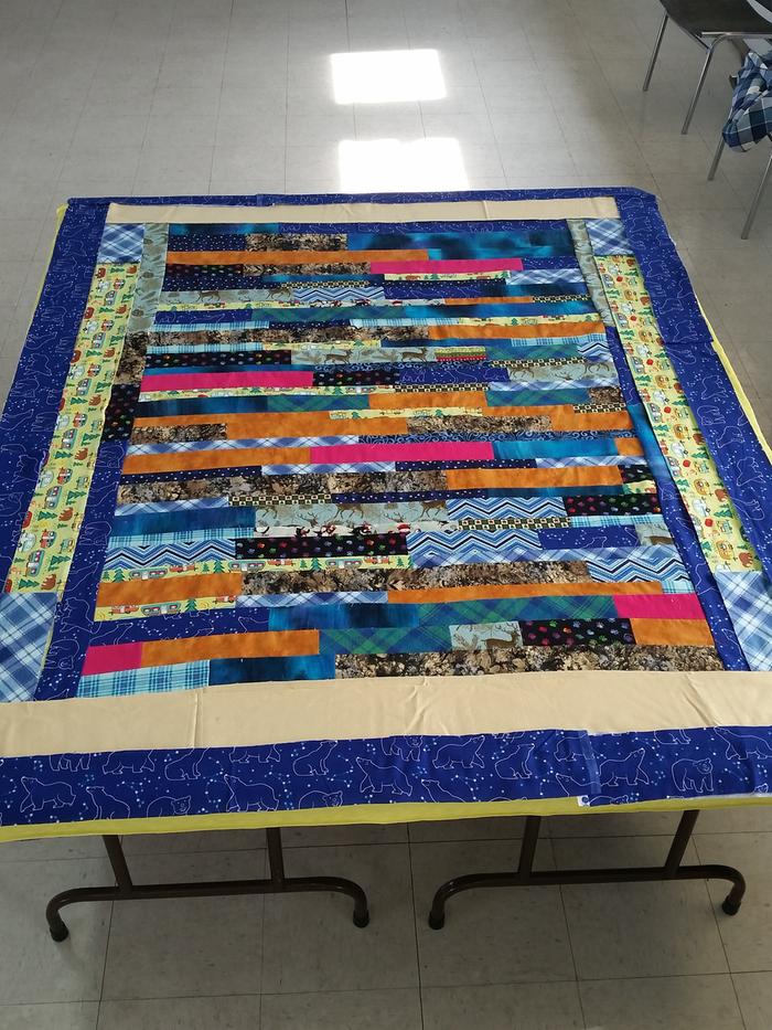 quilt top made of strips of fabric