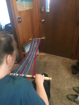 Putting the warp on the loom and securing it to the loom bars 