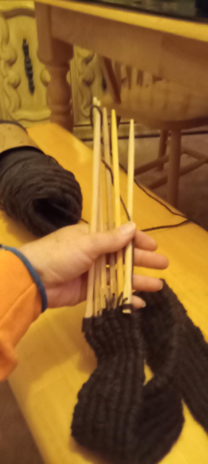 How I weave the yarn through the stick loom.