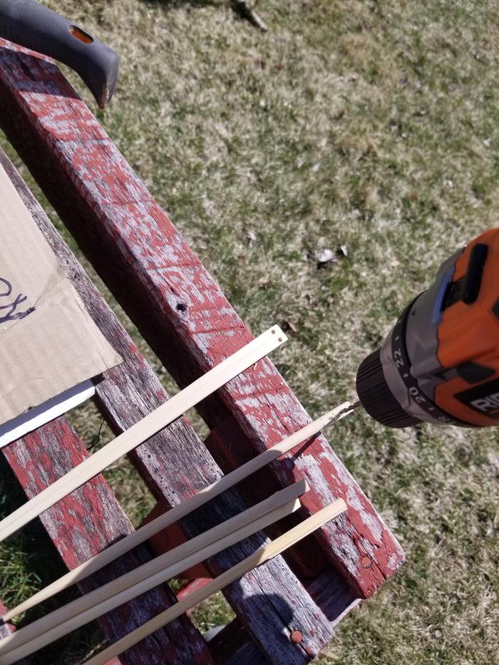 drilling the holes in the chopsticks 