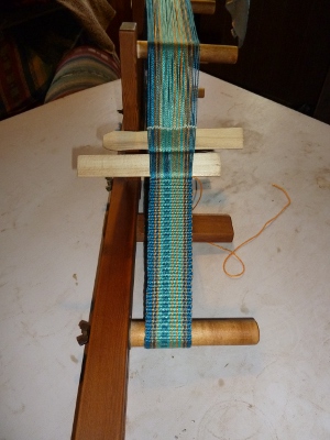 several inches of weaving completed