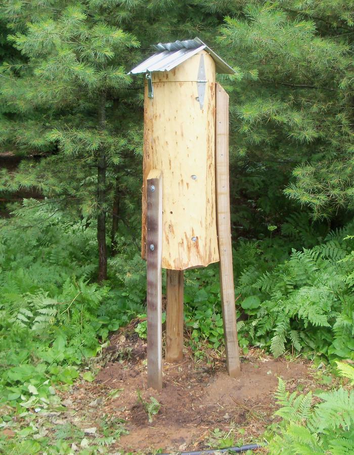 Installed. Bent post on right matched the curve of the hive :)