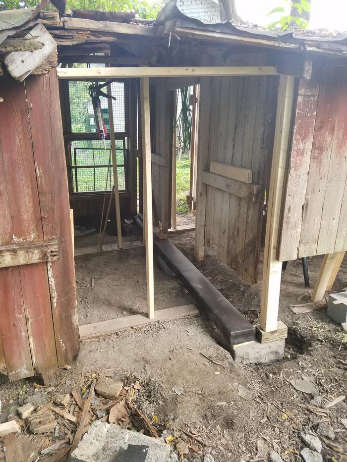 Cinder blocks placed, pair of 4"x4"x10' beams wrapped in tar paper and placed as new sub-floor perimeter