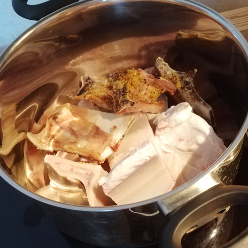 All bones (roasted and fresh) in a pot, to make a broth.