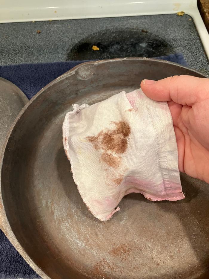 Wiping it down after it came out of the oven.