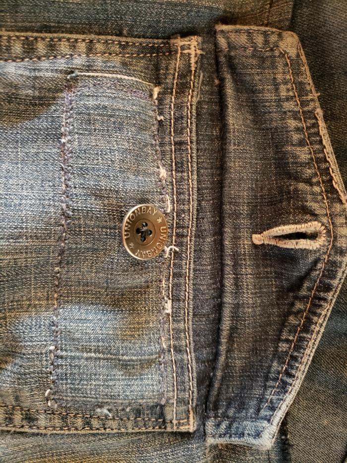 The patch to reinforce the button and add General strength to the top of the small pocket