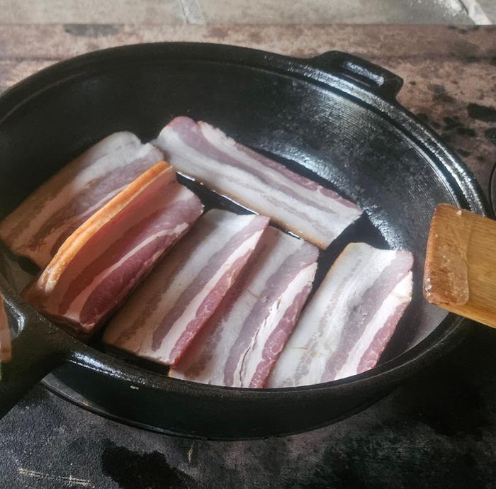 Bacon prep is cutting and sliding bacon into pan