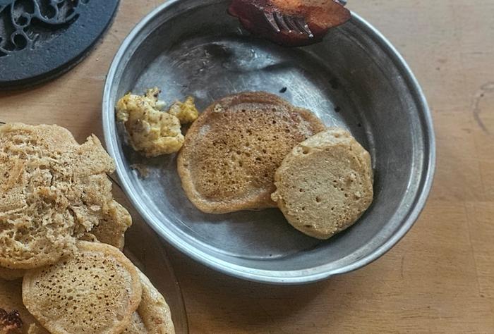 Chunk of fried eggs on a breakfast plate