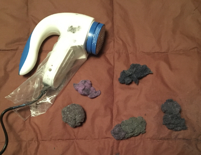 sweater shaver and lint balls from all five sweaters I revitalized