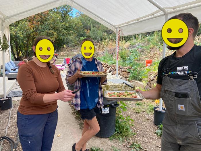 students feeding the oven