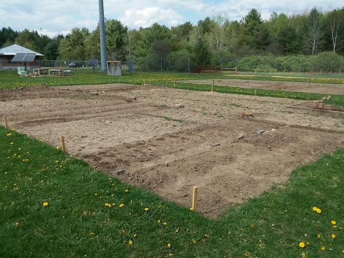 Plots marked out in the spring and gardeners getting started.