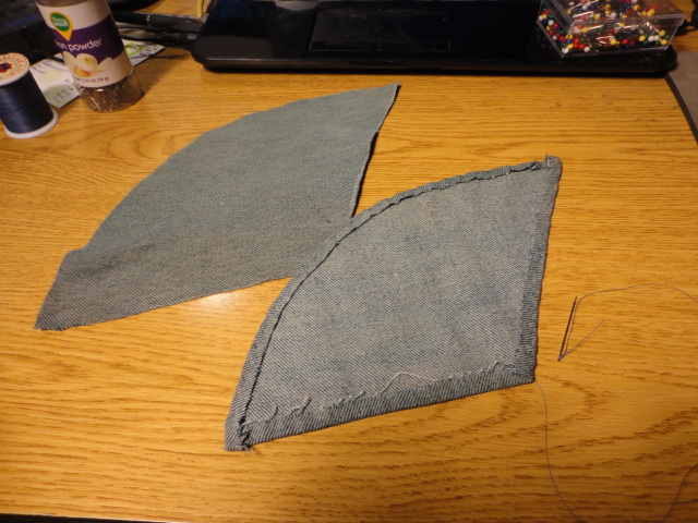 Partway through, the patches are cut and the edges are being finished.