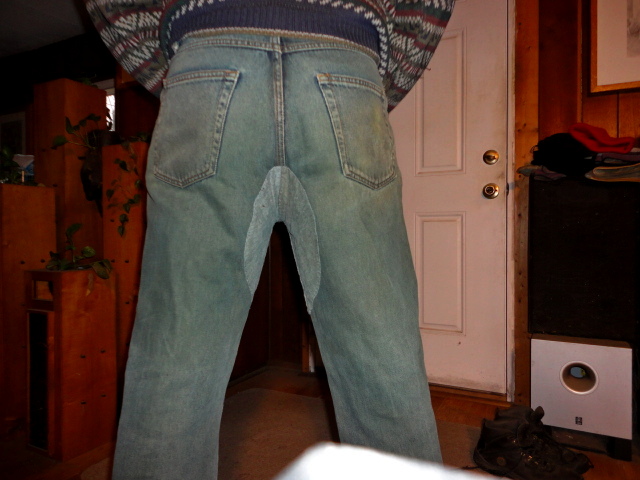 A final shot showing the repaired jeans being worn.