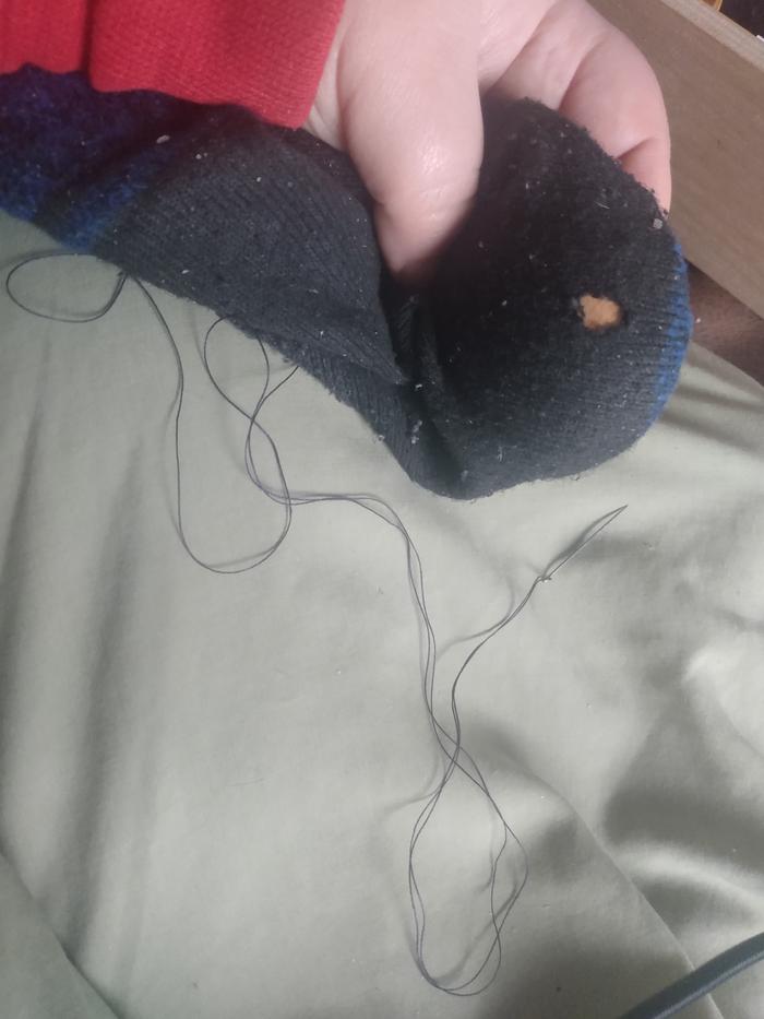 Holey sock thread and needle 