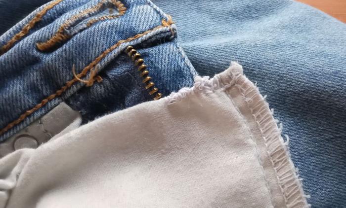 jeans pocket with mended hole