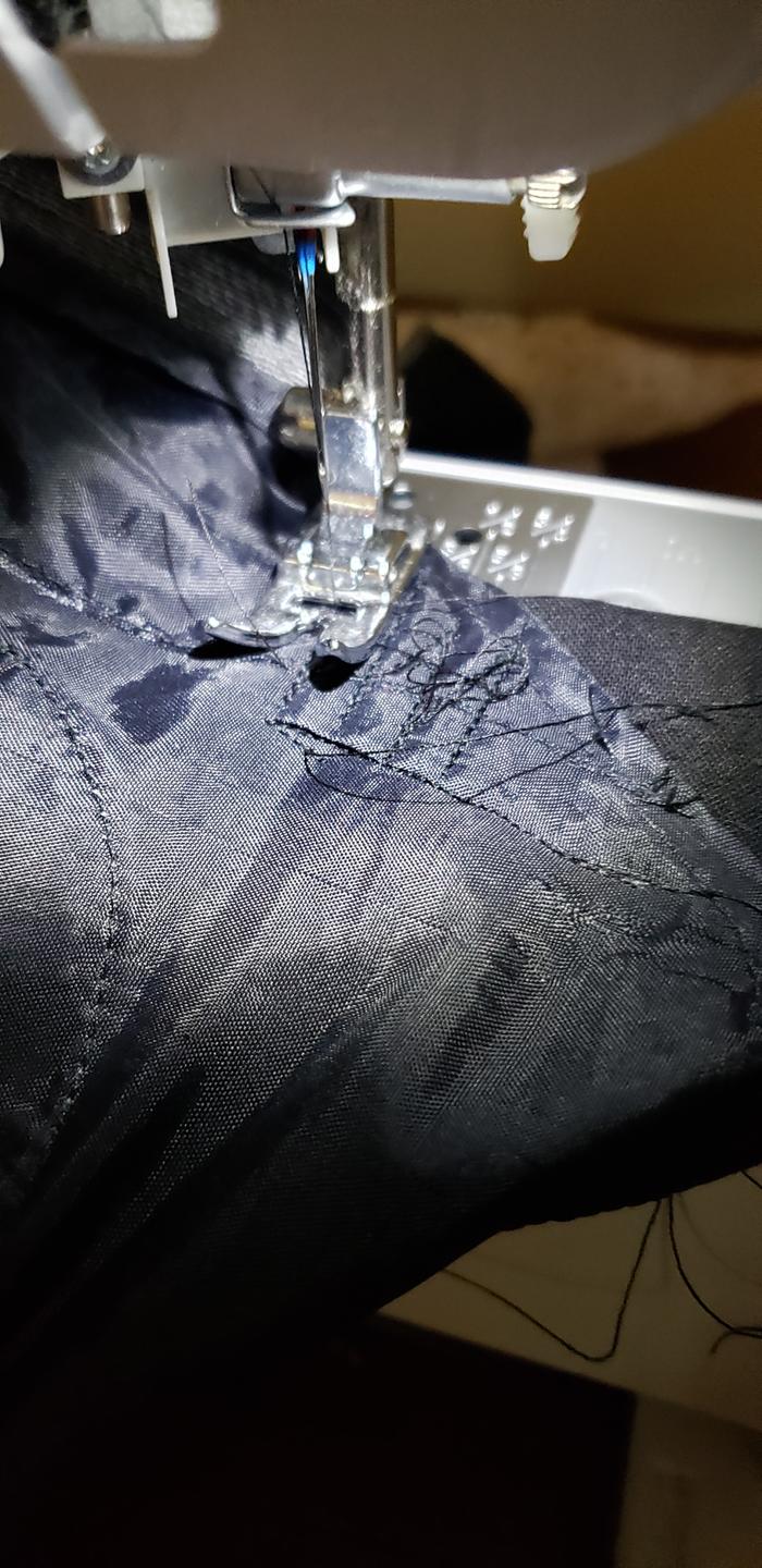 Machine mending in a somewhat awkward way to avoid the main fabric getting caught