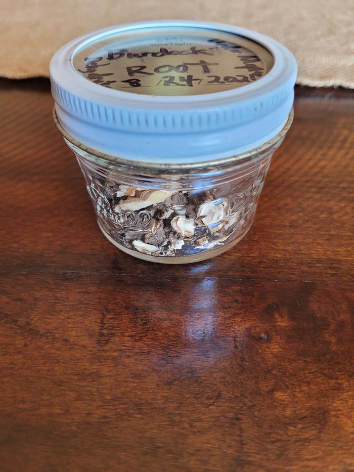 In a sealed and labelled jar 