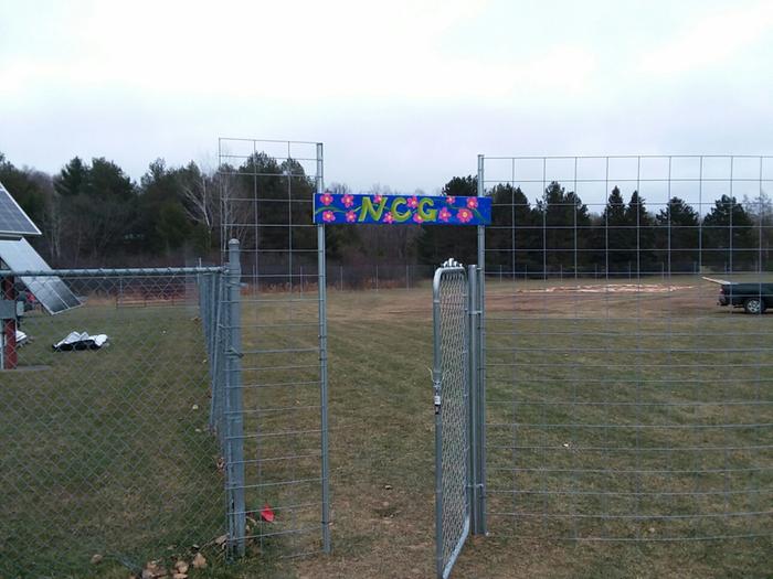 Sign on the way in. NCG &amp;#61; Northwoods Community Garden