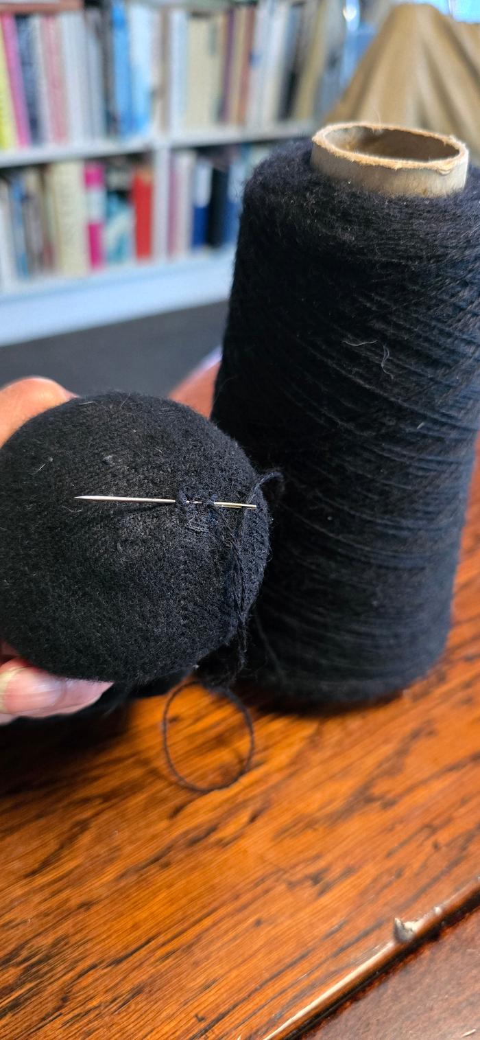 Darning the hole with wool