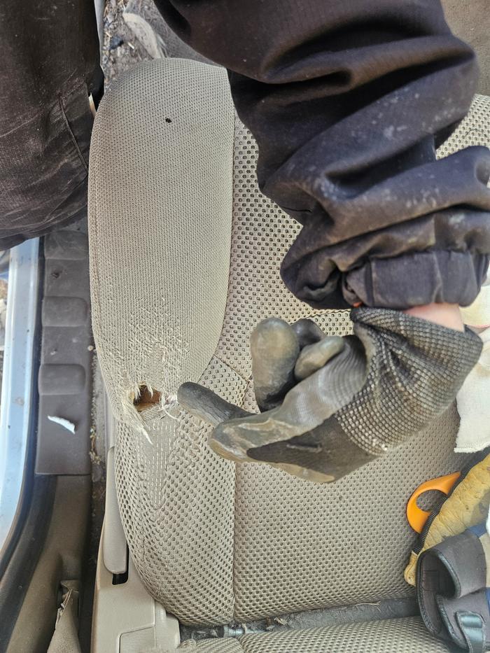 The hole in my dad's truck seat