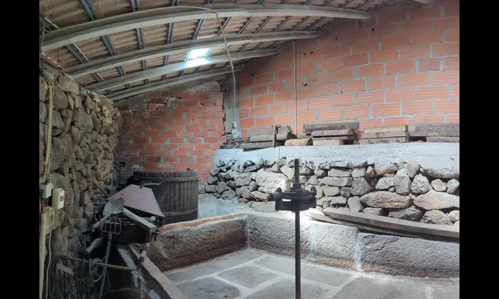 One old winery I saw, look at that granite wine press!
