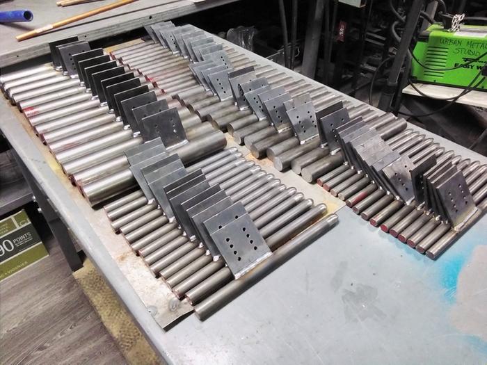 This photo shows the batch after all the plates have been welded on. They are lined up ready for grinding. Some got a pre-grind prior to welding.