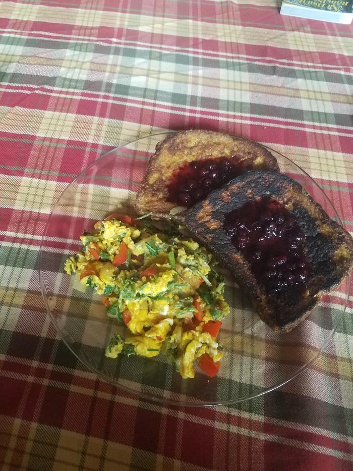 French toast with saskatoon jam, Scrambled eggs with red pepper, onions, dandelion and nettle greens