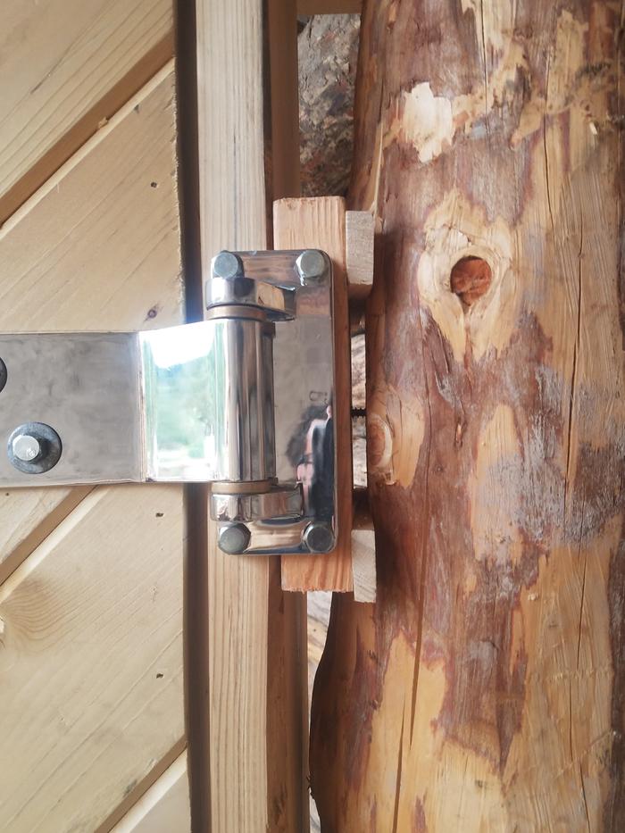 Then the hinges get the right two bolts.