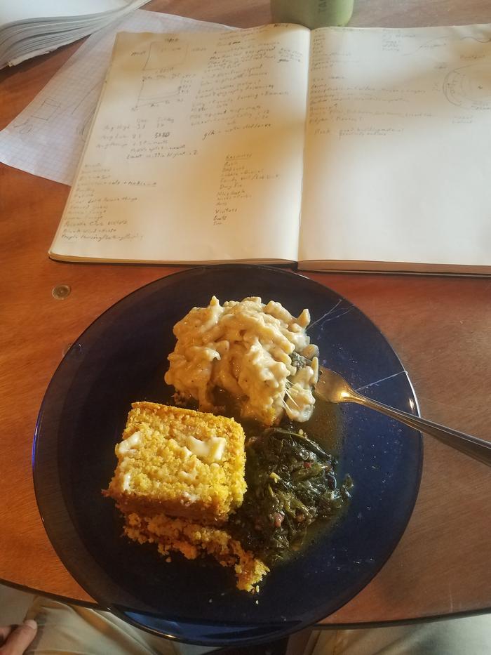 Having dinner while I sketch and brainstorm. Macaroni and cheese with corn bread and spicy greens.