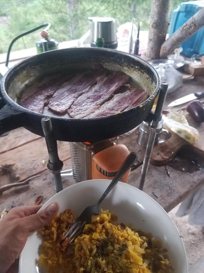 Bacon and eggs for dinner. This little stove is pretty neat.