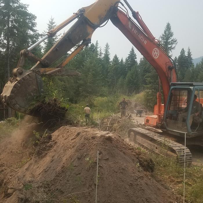 building a hugel bed with an excavator