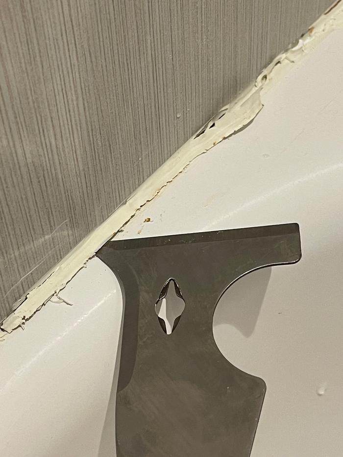 Removing old grout with a jointing knife