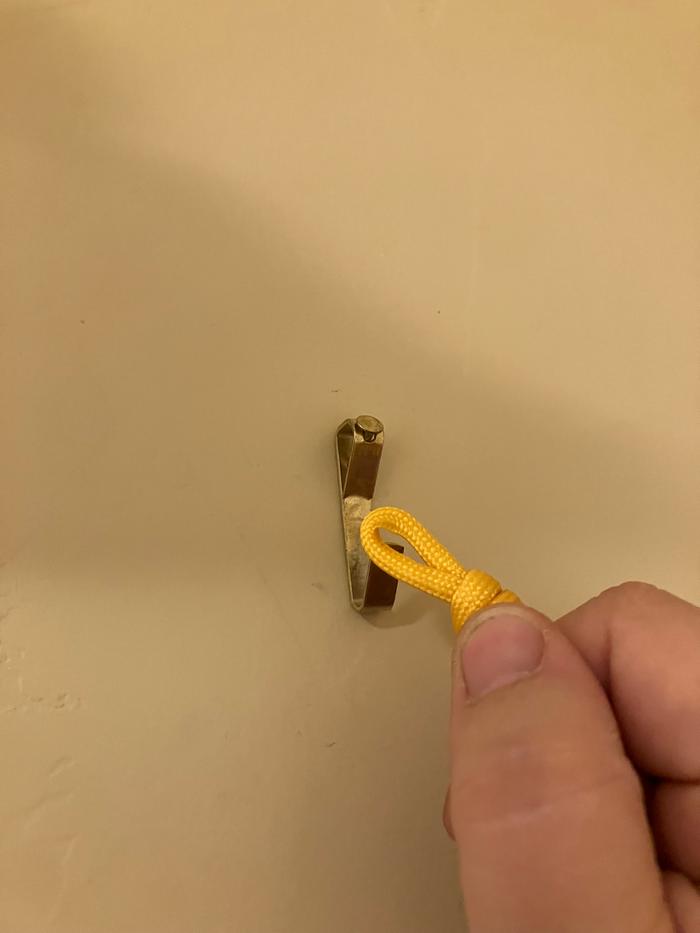 Hook installed, looping the cord on it.