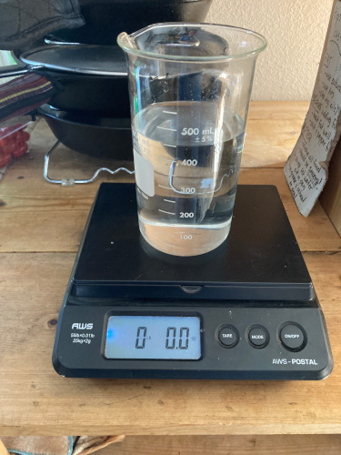 before: water on the scale in a beaker