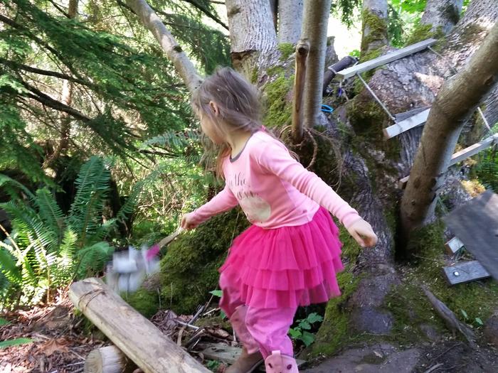 Happy daughter, dusting her Tree Fort House