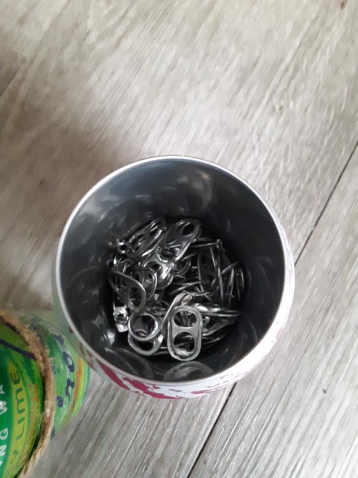 Soda can full of tabs