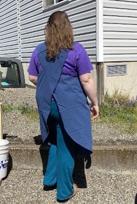 test-fitting the apron and adjusting the shoulder seams